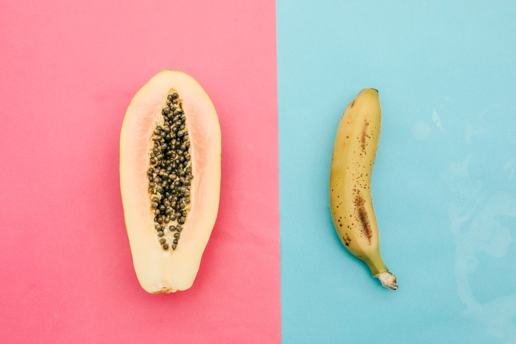 papaya and banana from above. Sex concept -