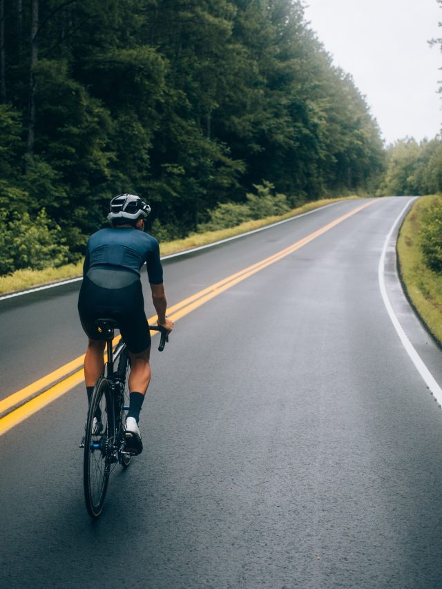 cropped-cyclist-man-riding-bike-road.jpg